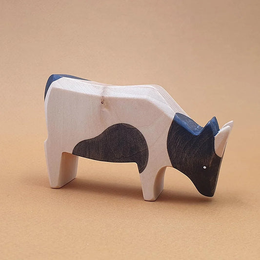 wooden black spotted cow